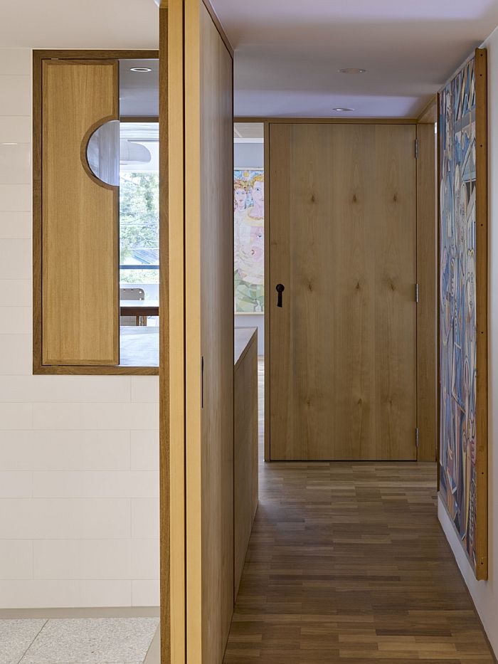 New-and-revamped-entry-of-the-house-clad-in-wood-and-white-35792