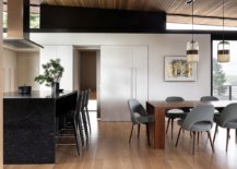 Open-plan-kitchen-and-dining-area-of-the-modern-home-with-a-stone-island-that-anchors-it-92389-217x155