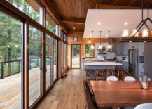Series-of-sliding-glass-doors-with-wooden-frames-connect-the-new-dining-area-and-kitchen-with-the-outdoors-97869-217x155