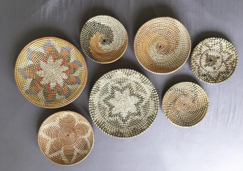 Seven wall rattan baskets in different designs and sizes