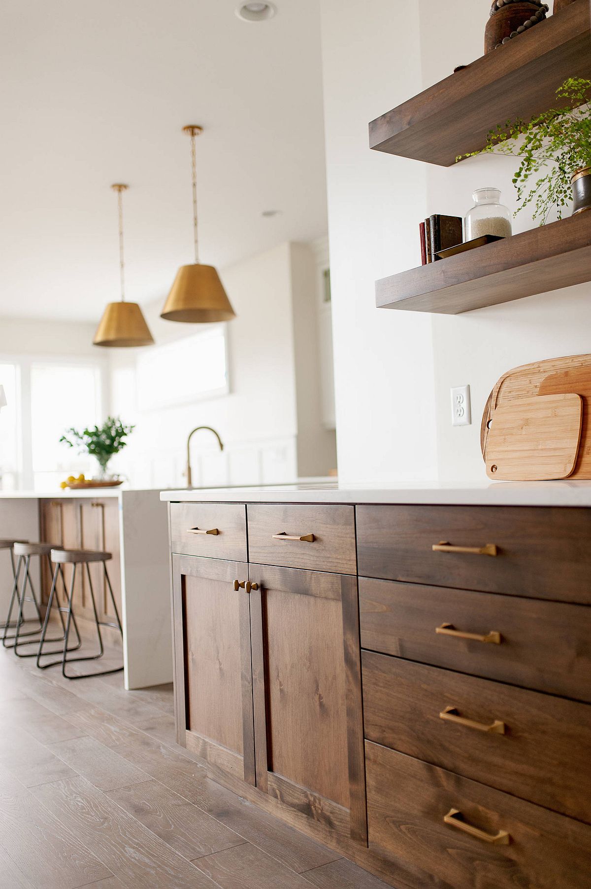 Sleek floating shelves and shaker style cabinets in wood for the modern farmhouse kitchen