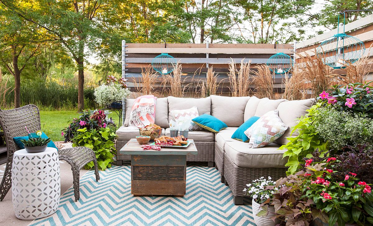 Small-and-elegant-backyard-patio-with-chevron-pattern-rug-and-comfy-decor-exudes-shabby-chic-style-47183