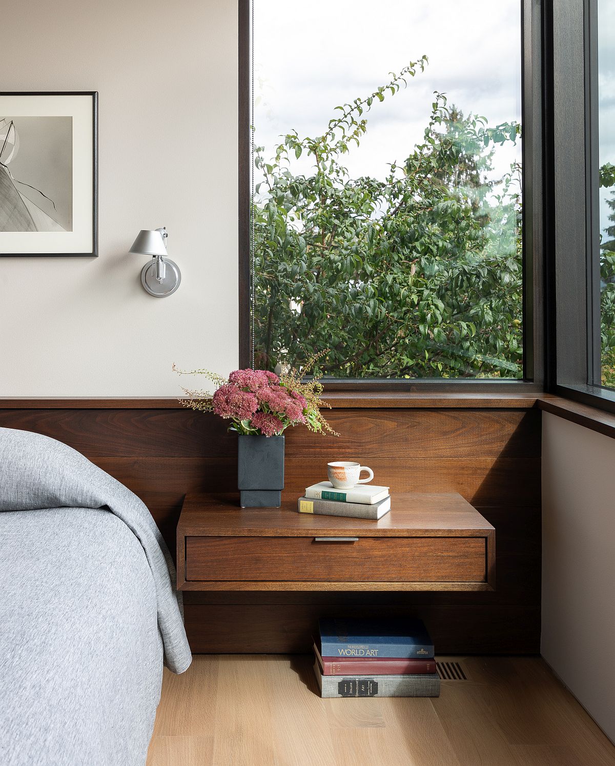 Small floating nightstand in wood with a sleek drawer that offers smart storage space