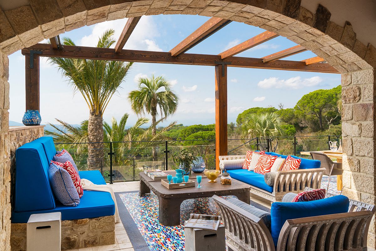 Stone walls and archways add a sense of authenicity to the charming Mediterranean patio