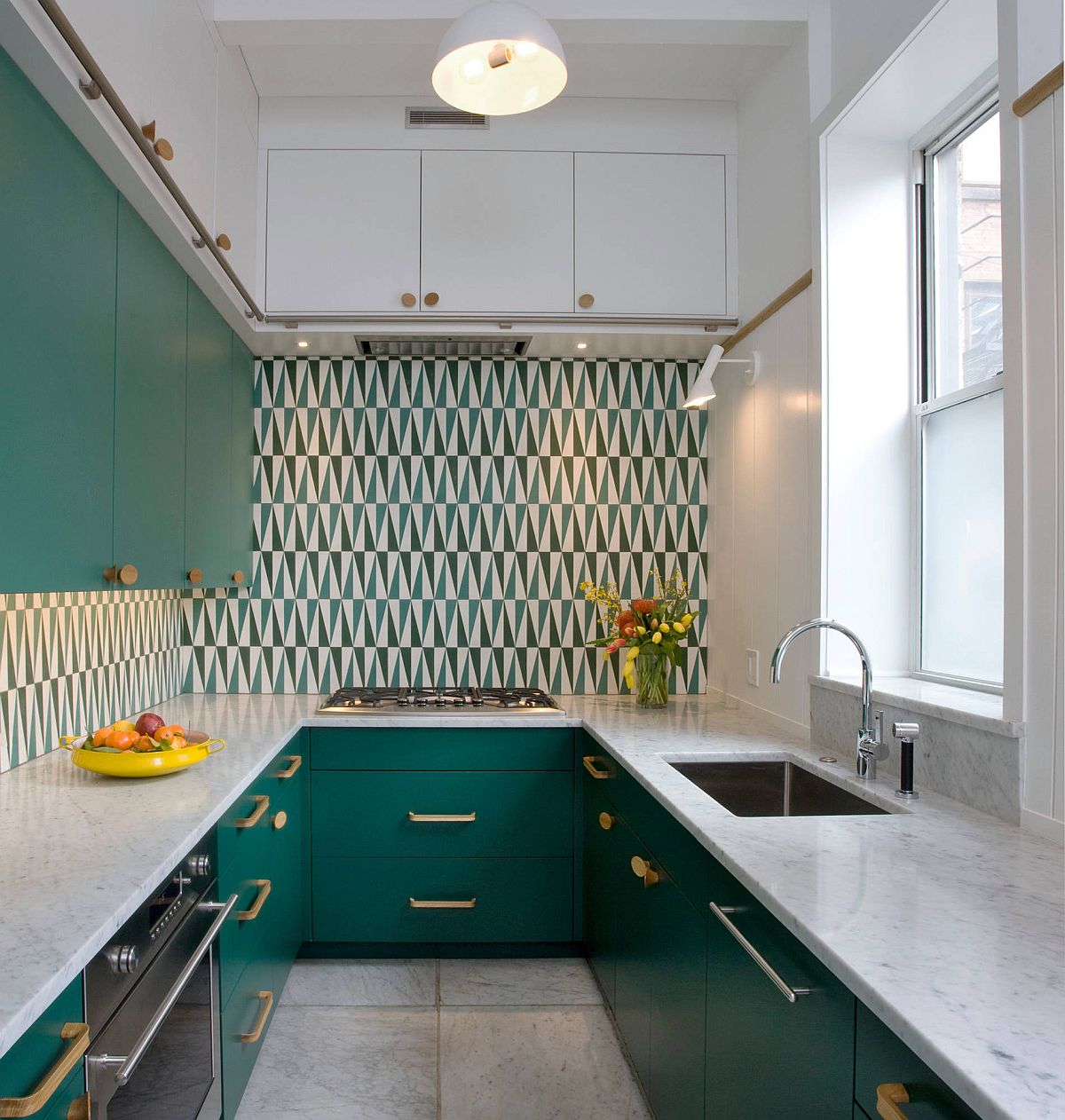 Using dark green cabinets in the small modern kitchen along with a snazzy backsplash