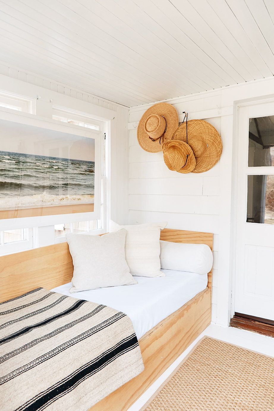 Wooden chair and woven beach hats