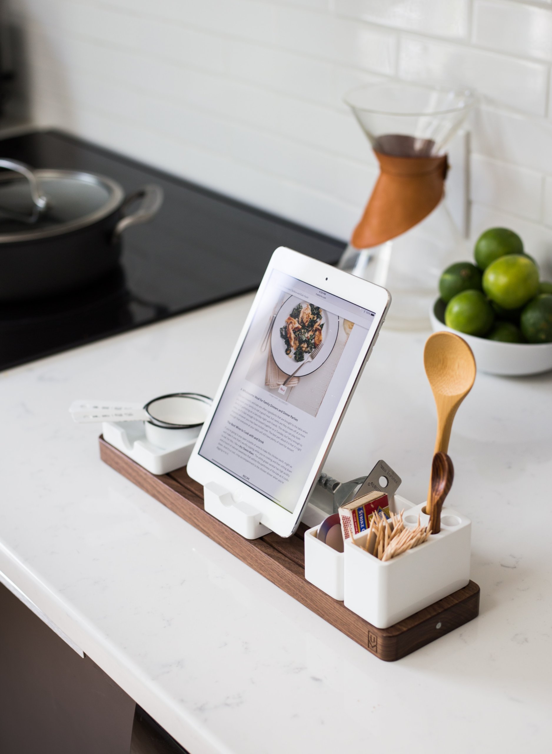 White tablet standing on top of white counter