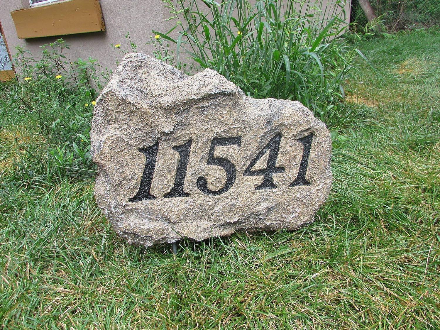 House number on a large stone.