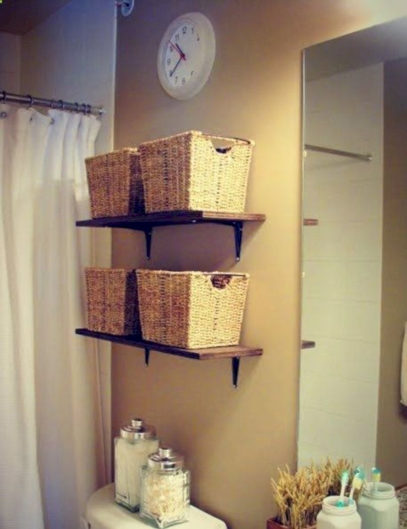 Bathroom with four wicker baskets on shelves
