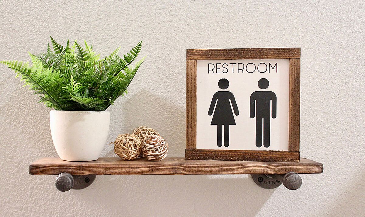 Beautiful and small restroom sign can be placed on the small shelf in the bathroom pretty much anywhere