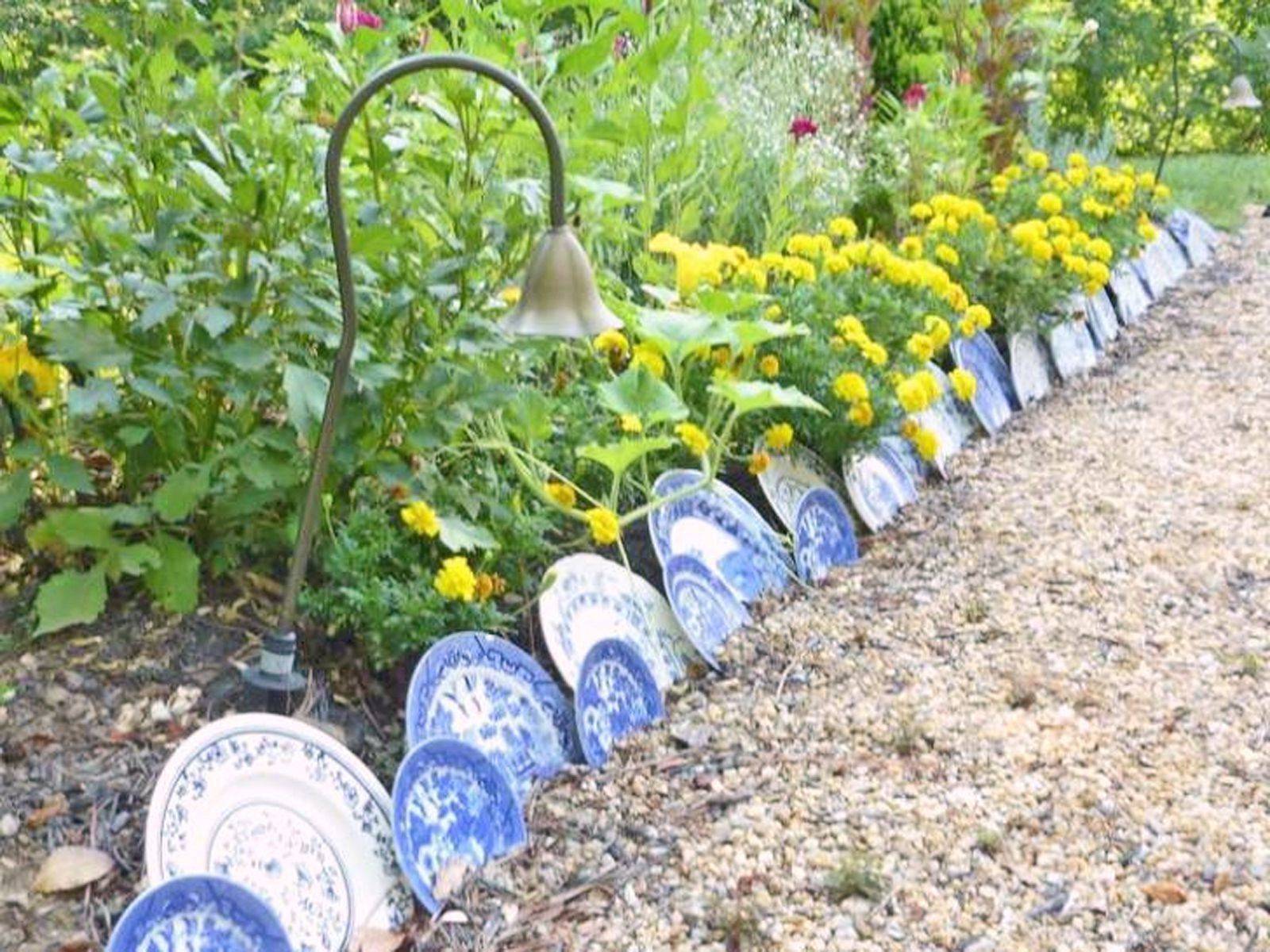 Blue and white plates lined on the ground