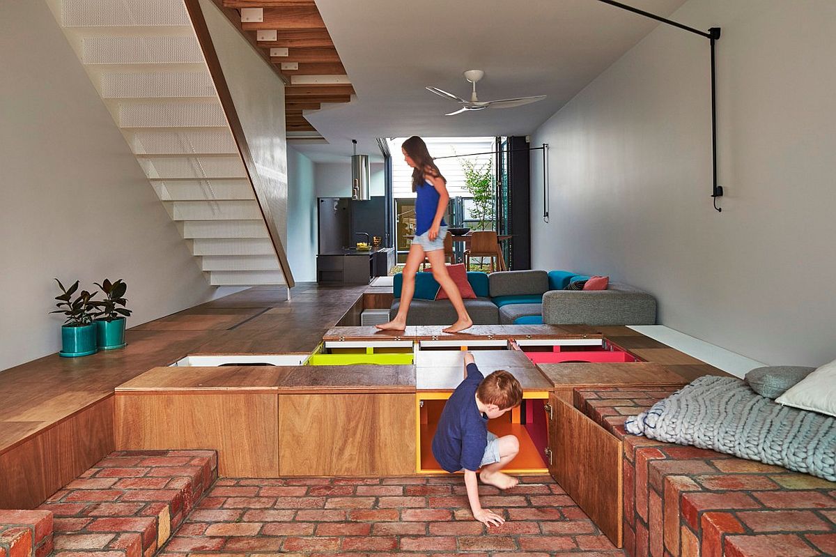 Boxes built into the floor offer amazing storage space in this modern home