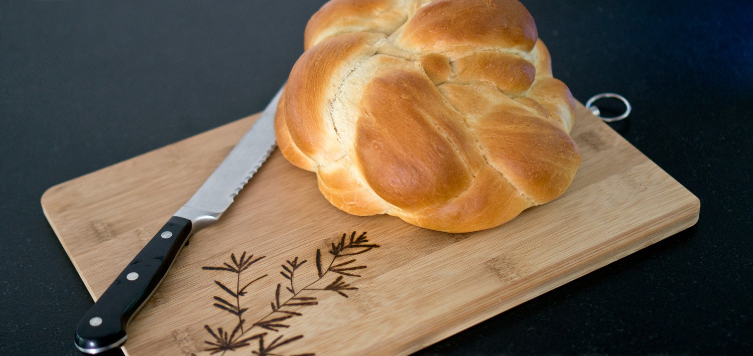 Bread and knife on top of cutting board