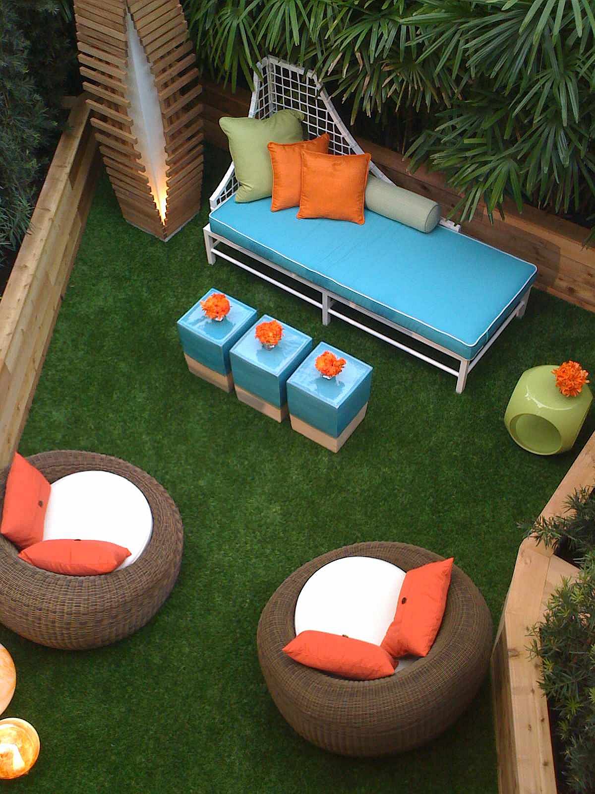 Brilliant blue seats along with curated orange accents for the small outdoor patio