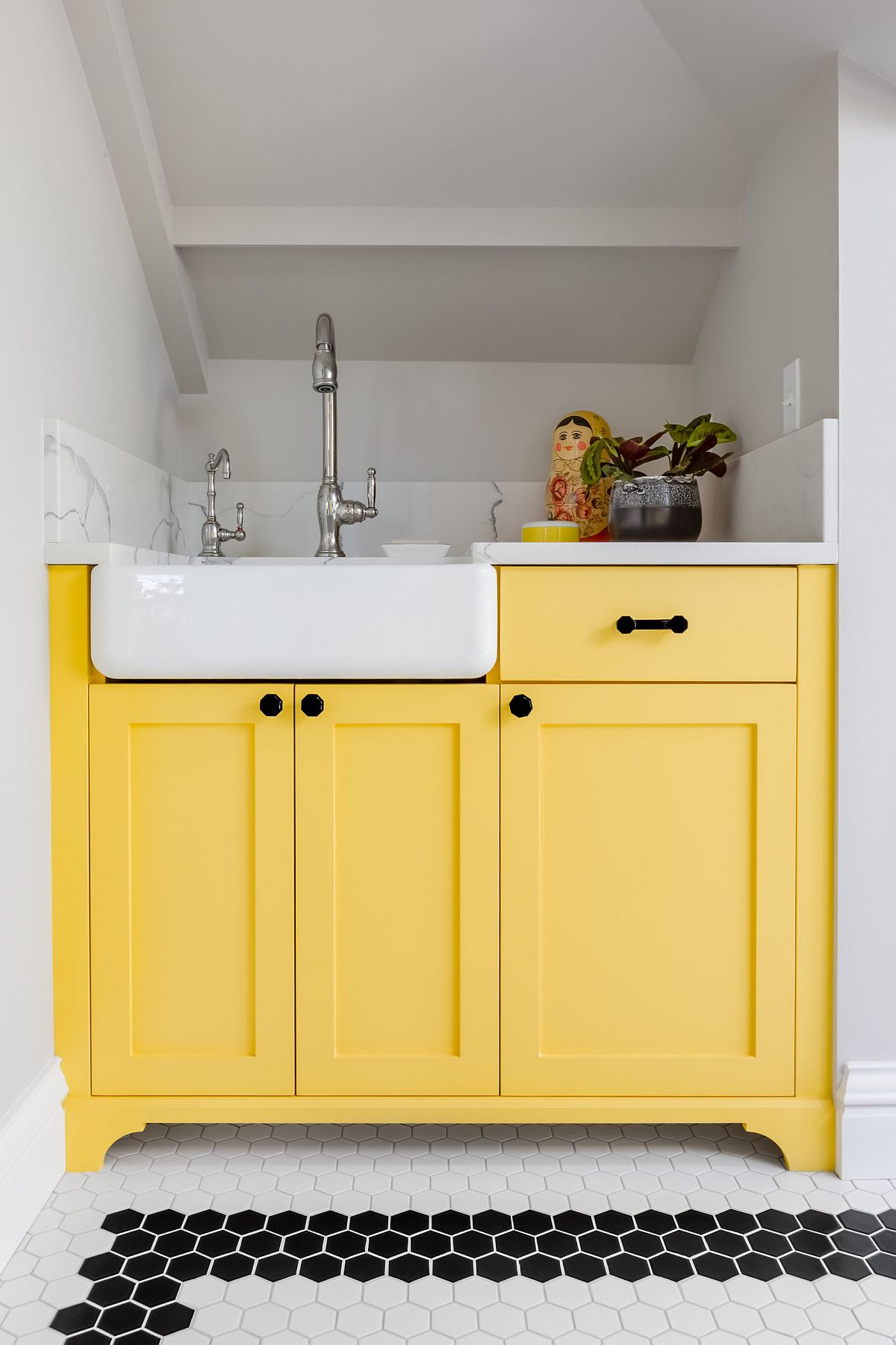 Cabinets in beautiful yellow add sparkle and freshness to the modern neutral interior