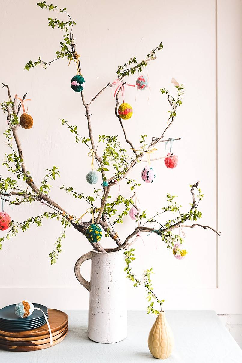 Colorful eggs on potted plant