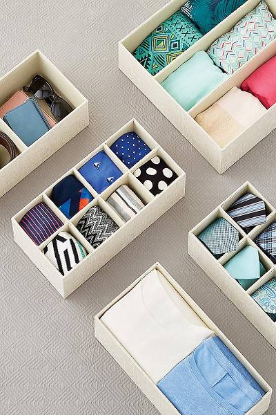 organized storage boxes with clothing inside