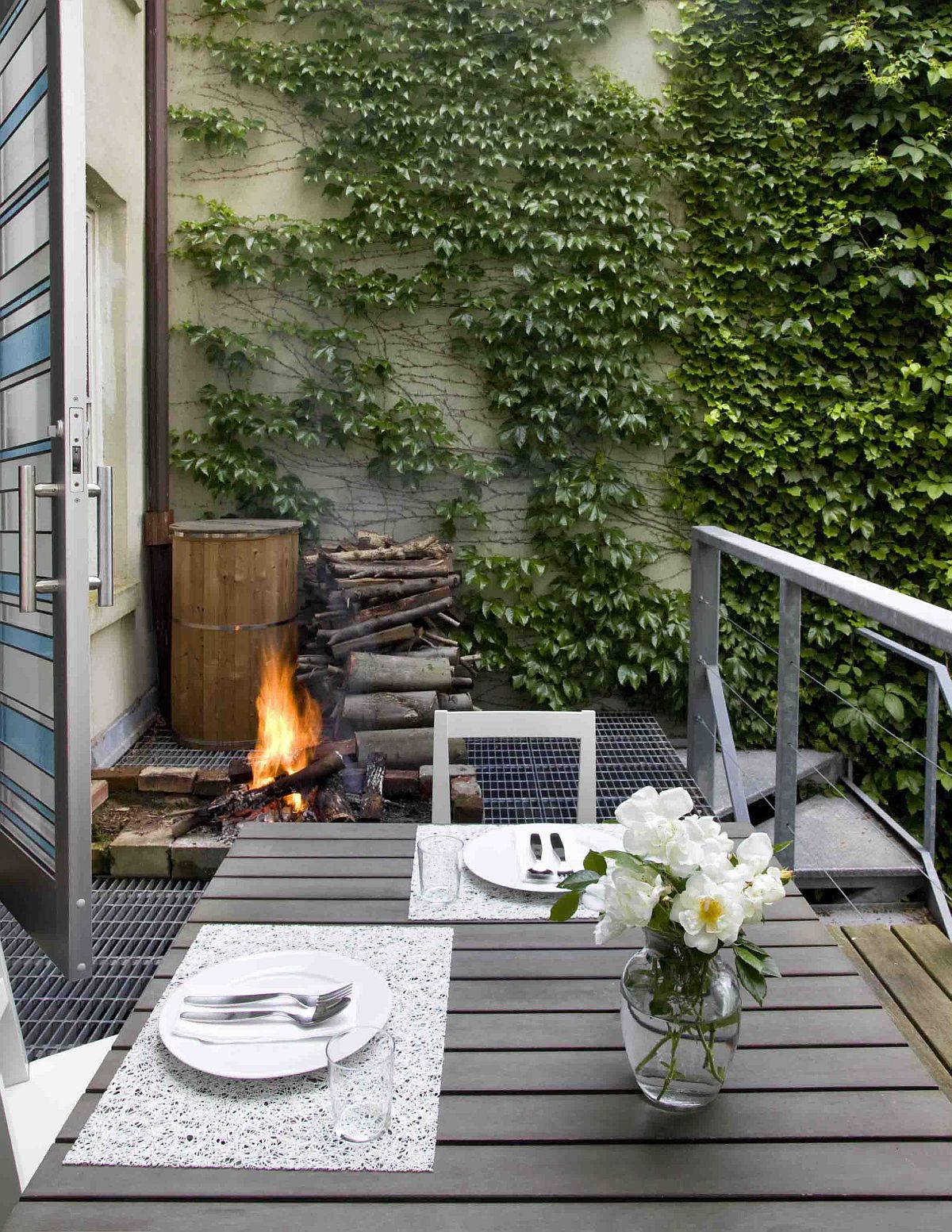 Cozy-and-comfortable-small-contemporary-deck-with-a-fireplace-20524