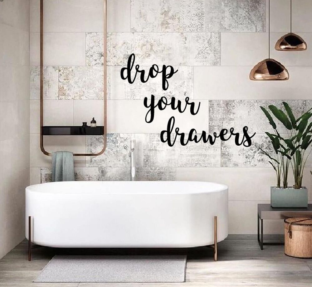 Custom wall decal in the bathroom ends up stealing the spotlight in contemporary setting