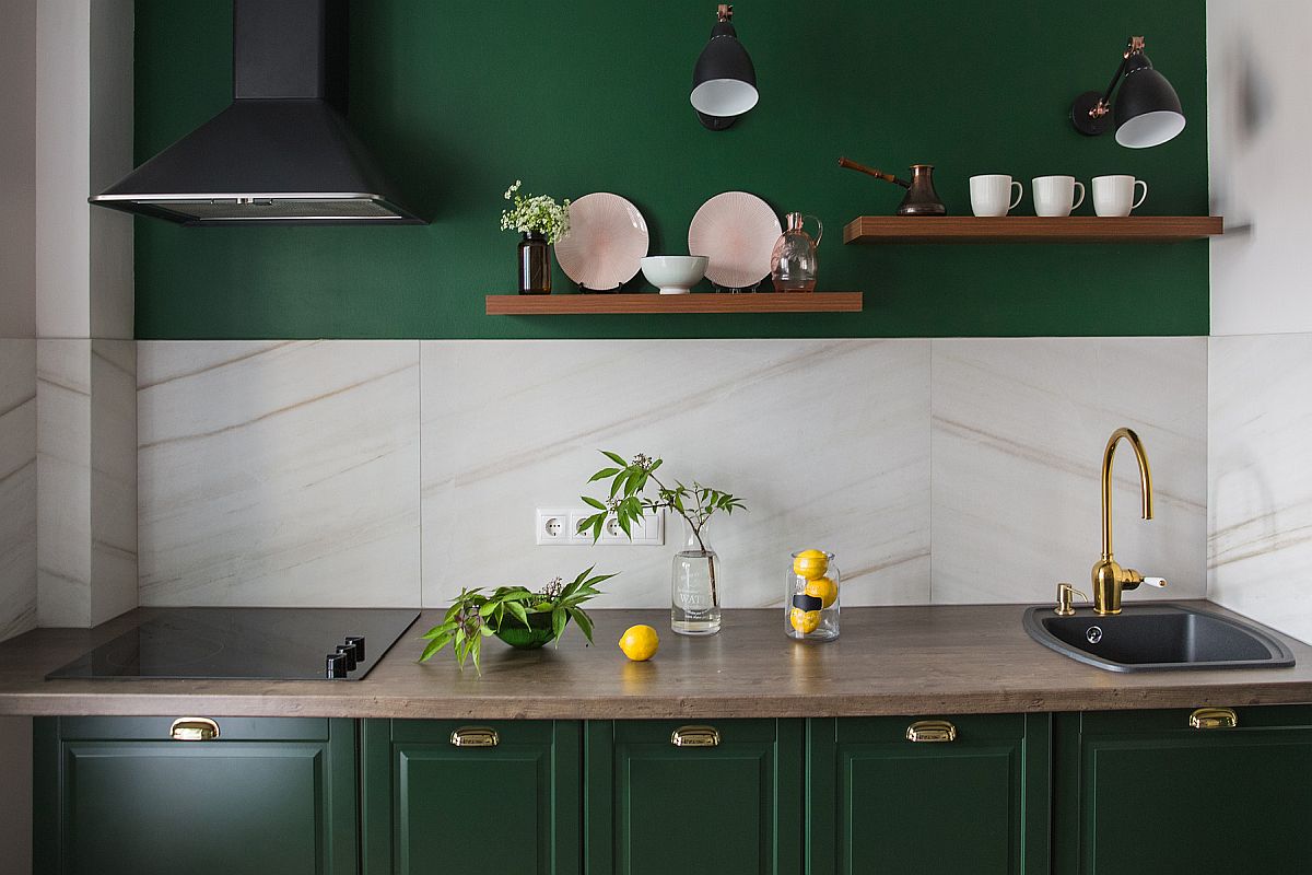 Dashing dark green cabinets combined with white marble in small contemporary kitchen