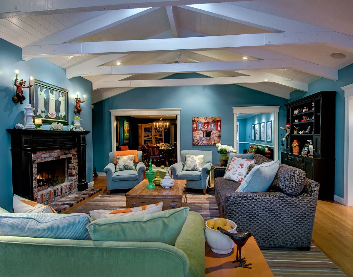 Different shades of teal make an impact in this spacious modern living room