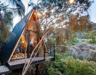 Small A-Frame Treehouse in the Woods made from Recycled Materials