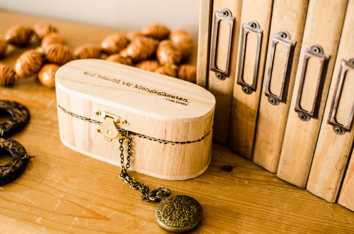 Engraved wood jewelry box with locket