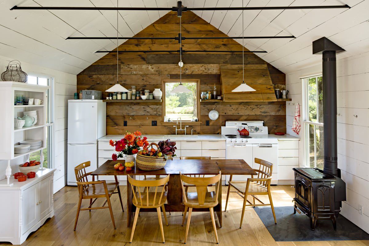 Fireplace in this modern rustic kitchen becomes an instant focal point