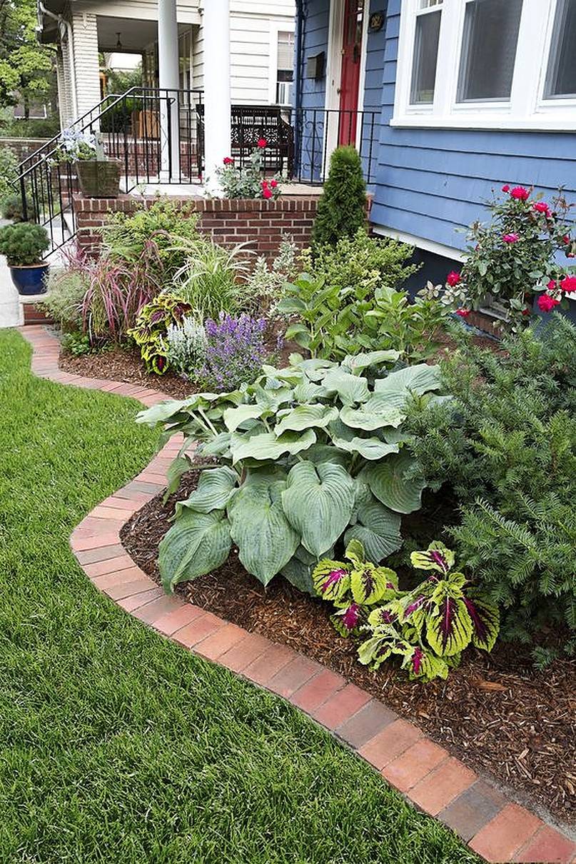 Flower bed in front of white window