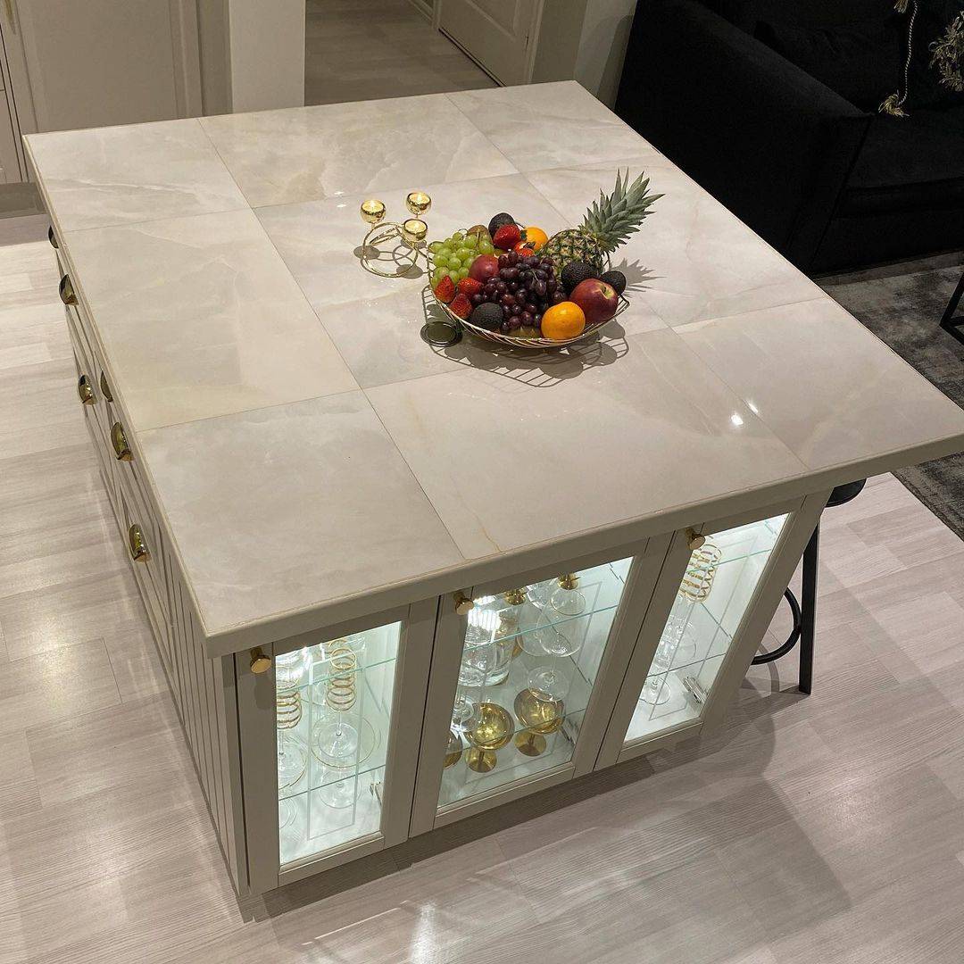 Fruit platter and candle holder on tiled countertop