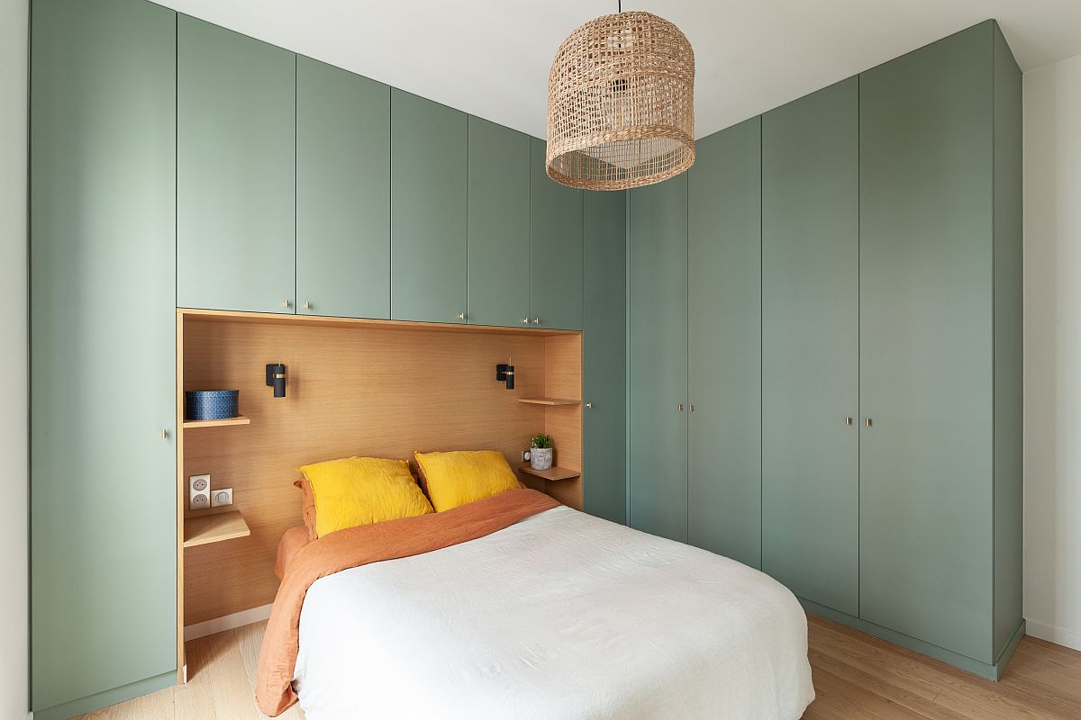 Gorgeous light green cabinets for the modern Paris bedroom bring color and contrast