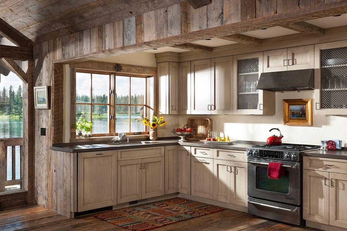 Gorgeous rustic kitchen with weathered woodsy cabinets and ample natural lighting