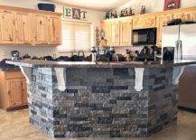 Gray kitchen island with granite and stones