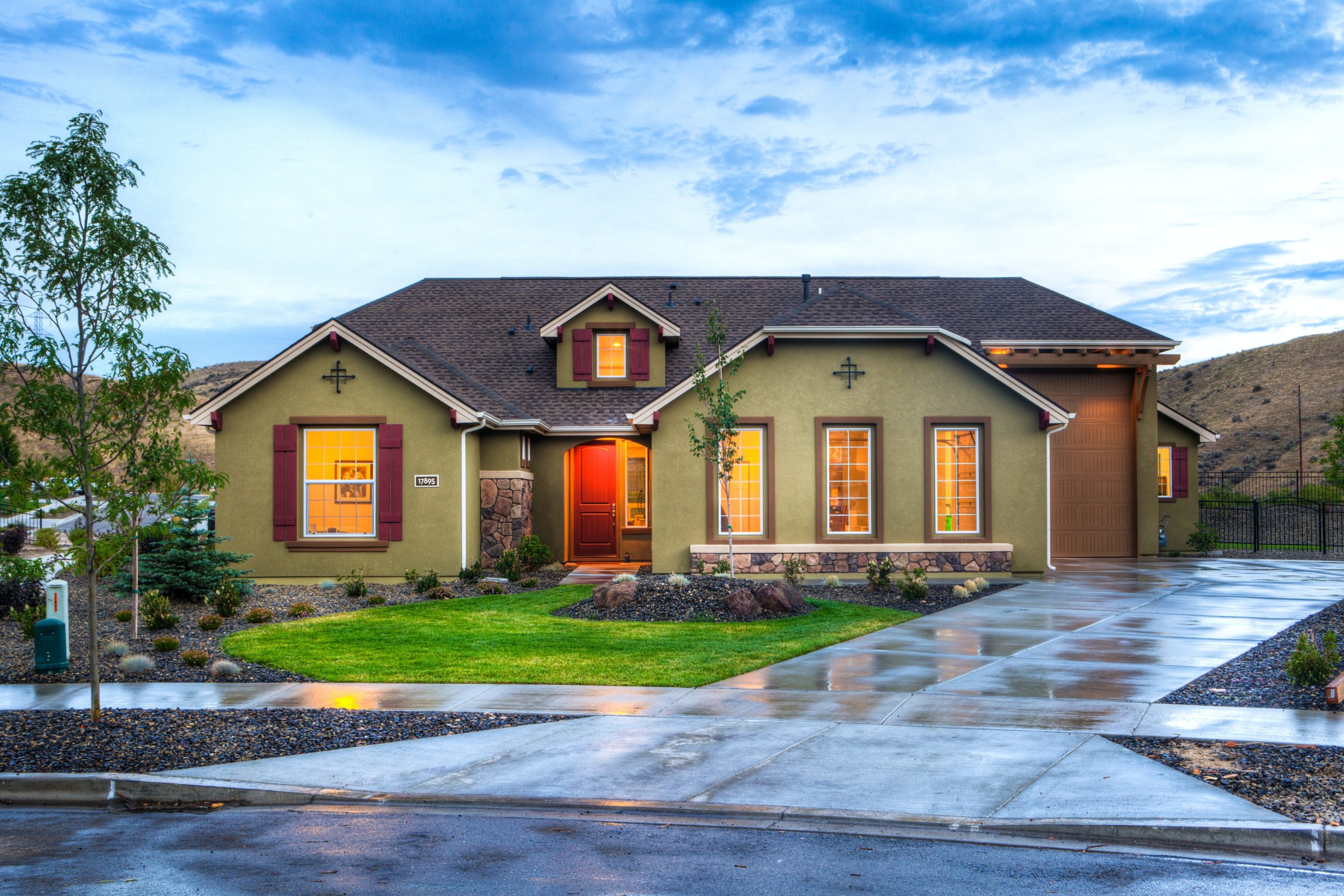 House with well-kept grass front lawn