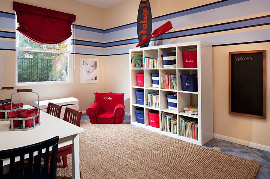 Kids' room with nautical style fetaures an open shelf for toy storage along with baskets