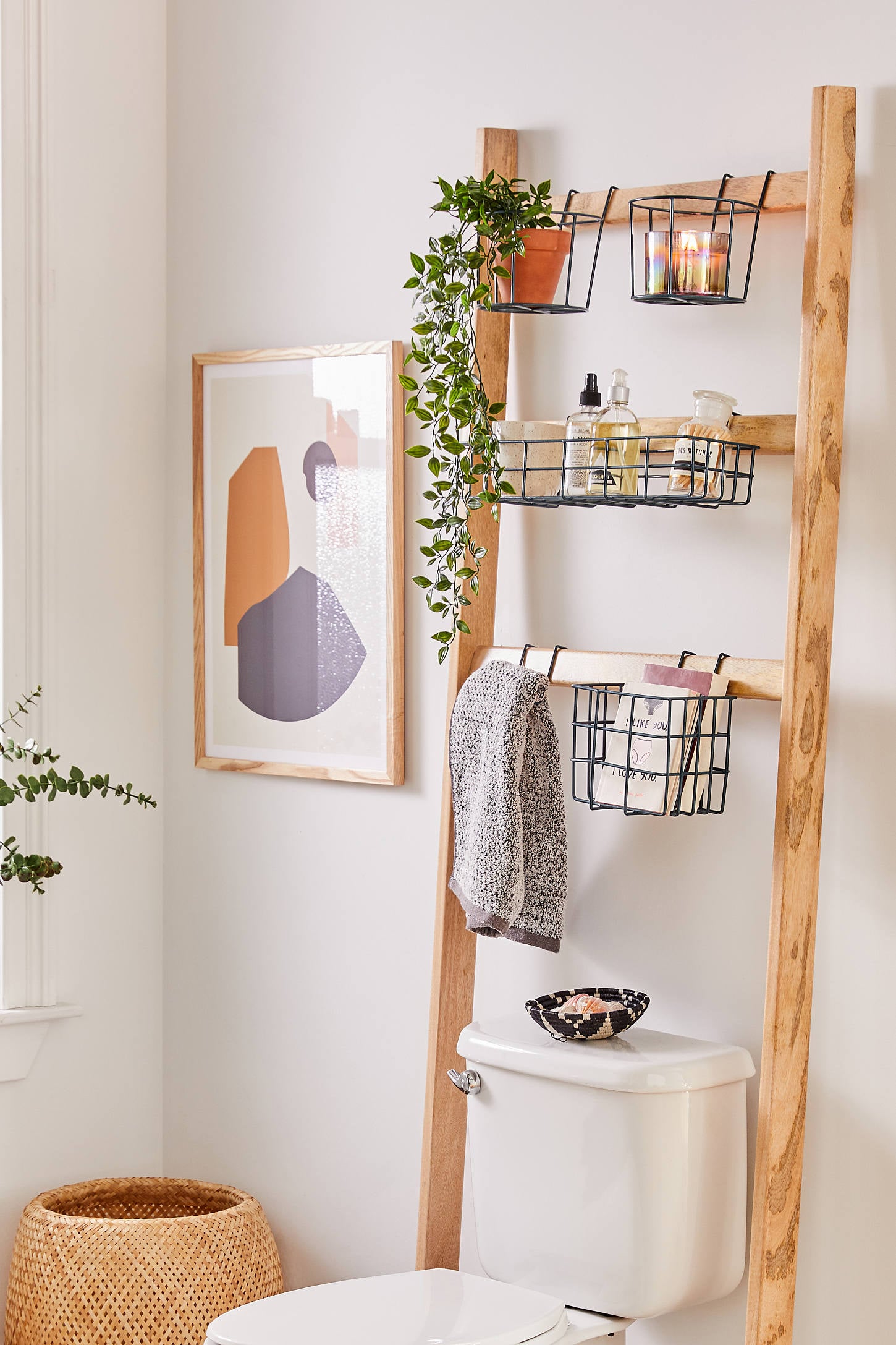 Baskets behind toilet  Bathroom towel storage, Baskets on wall