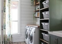 Laundry room with herringbone flooring
