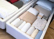 under mattress storage linens and clothes stored away in mattress