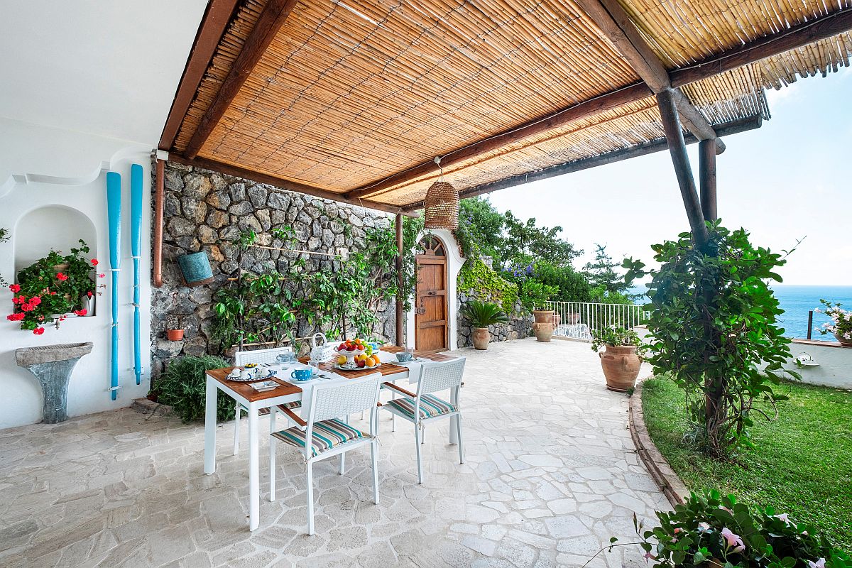 Mediterranean style deck and pergola offers ample shade