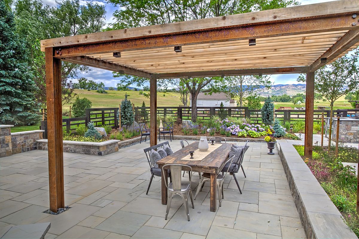 Modern rustic patio with oudoor dining area and a standalone pergola structure