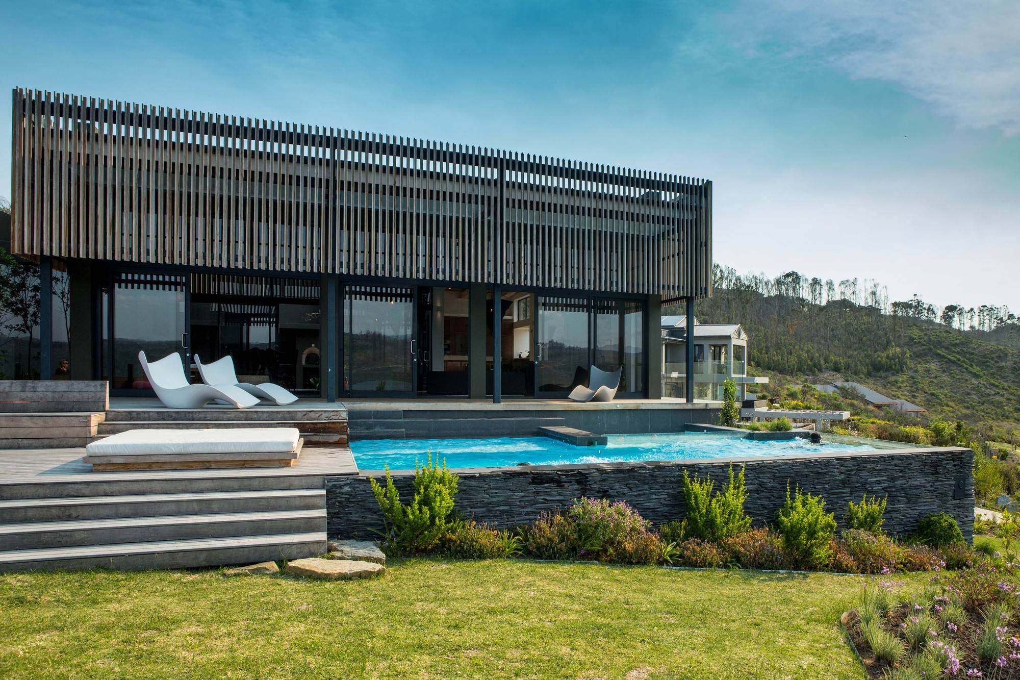 Outdoor pool area and hangout of the South African home with fabulous views of the outdoors