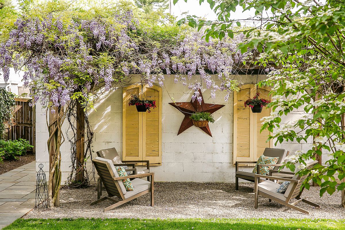 Pergola structure is entirely covered in vines giving it a dreamy, whimsical charm