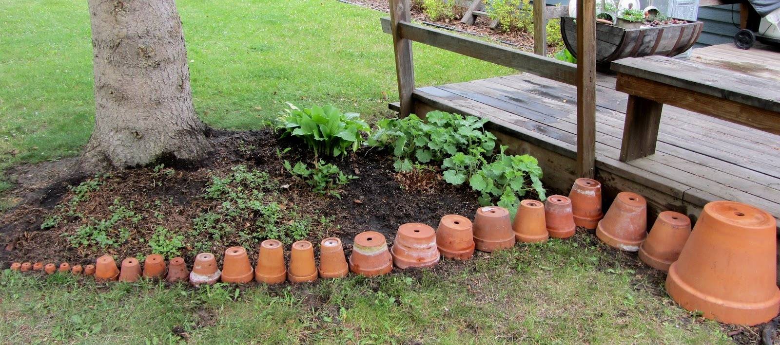 Pots lined from smallest to biggest