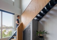 Revamped-staircase-in-wood-and-metal-connects-the-two-levels-of-the-loft-home-44210-217x155