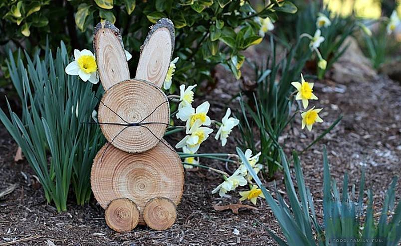 Rustic wooden bunny in a garden
