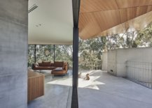 Sliding-glass-doors-connet-the-interior-with-the-outdoors-even-as-the-folded-roof-in-wood-steals-the-spotlight-91777-217x155