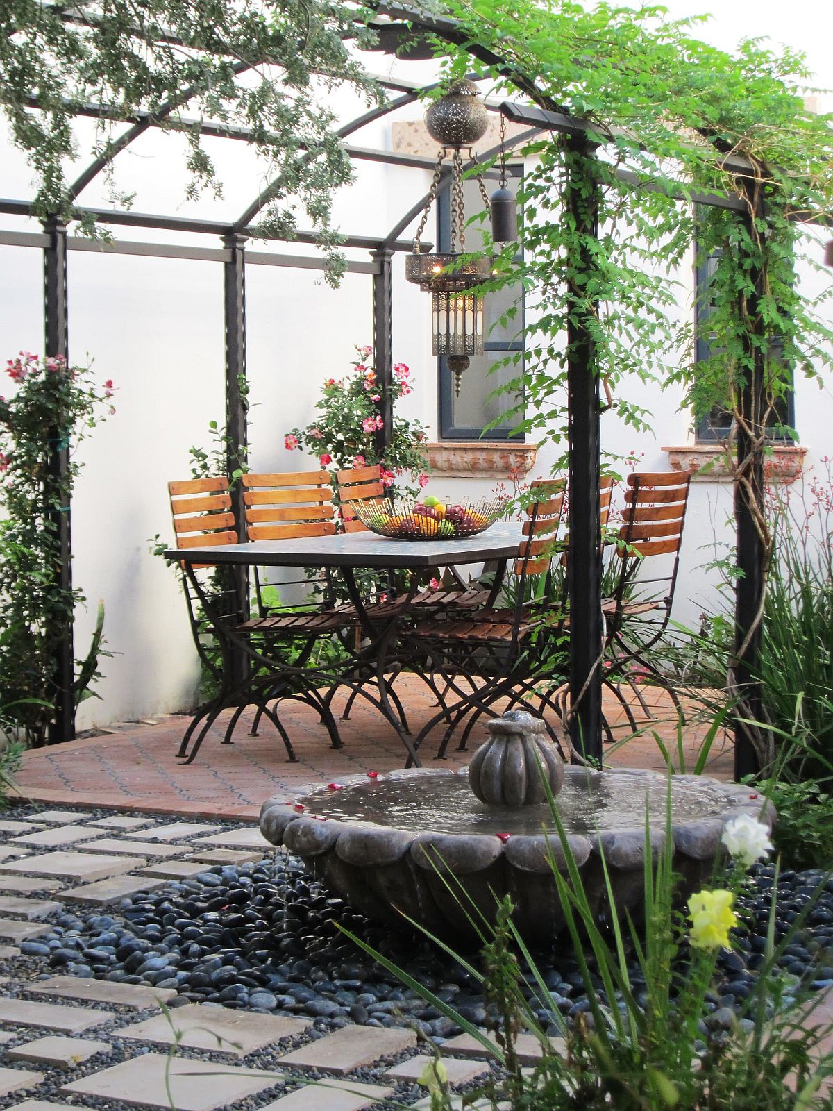 Slim pergola structure coupled with with creepers to create shade in the garden