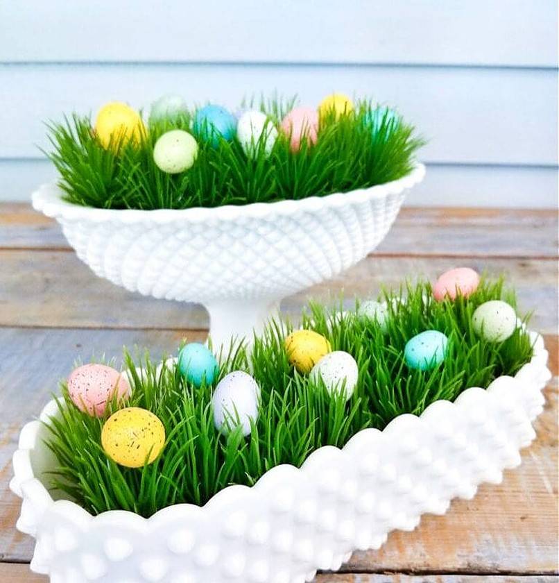 Small eggs in faux grass planters