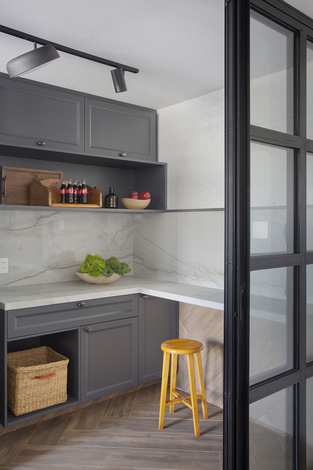 Small modern kitchen in gray and white with wooden floor