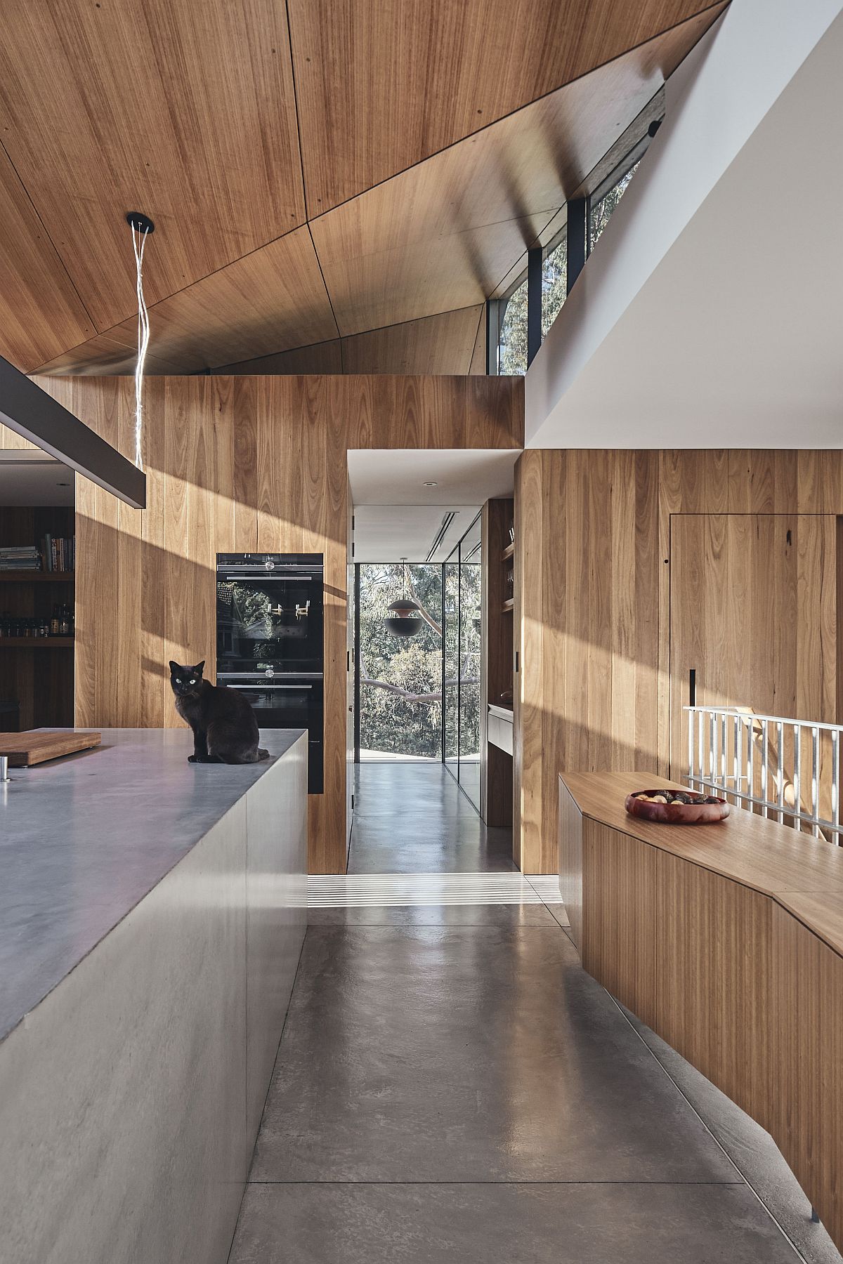 Spacious and well-lit kitchen of the house in wood and white with lovely cabinets